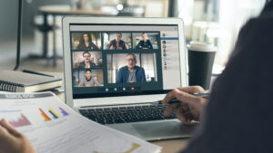 Microsoft Teams concept. Videoconference call in progress on laptop.